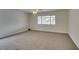 Bedroom featuring neutral carpet, white trim, and ceiling fan at 5416 Lochmor Ave, Las Vegas, NV 89130