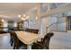 Bright dining room features tile flooring, large windows, and elegant chandelier lighting at 5416 Lochmor Ave, Las Vegas, NV 89130