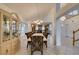 Bright dining room features tile flooring, large windows, and elegant chandelier lighting at 5416 Lochmor Ave, Las Vegas, NV 89130