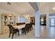 Bright dining room features tile flooring, large windows, and elegant chandelier lighting at 5416 Lochmor Ave, Las Vegas, NV 89130