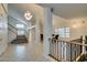 Grand foyer featuring tile flooring, a staircase, and elegant lighting at 5416 Lochmor Ave, Las Vegas, NV 89130