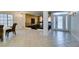 Grand entrance foyer featuring tile flooring, staircase, and chandelier at 5416 Lochmor Ave, Las Vegas, NV 89130