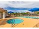 Relaxing hot tub area with a sparkling tub, shaded seating, and meticulously maintained surroundings at 5416 Lochmor Ave, Las Vegas, NV 89130