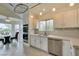 Bright kitchen with stainless steel appliances, white cabinets, and tile floors at 5416 Lochmor Ave, Las Vegas, NV 89130