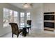 Sunlit breakfast nook featuring built-in ovens, tiled floor, and large windows overlooking the backyard at 5416 Lochmor Ave, Las Vegas, NV 89130