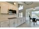 Well lit kitchen featuring white cabinets, tile floors, and stainless steel appliances at 5416 Lochmor Ave, Las Vegas, NV 89130