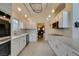 Well lit kitchen featuring white cabinets, tile floors, and stainless steel appliances at 5416 Lochmor Ave, Las Vegas, NV 89130
