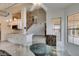 Open-concept kitchen and breakfast nook, offering plenty of room to dine with stairs in the background at 5416 Lochmor Ave, Las Vegas, NV 89130