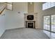 Spacious living room with fireplace and sliding glass door that provides natural light at 5416 Lochmor Ave, Las Vegas, NV 89130