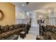 Elegant living room with tile flooring and dining area beyond at 5416 Lochmor Ave, Las Vegas, NV 89130