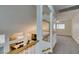 Bright, open floor plan with staircase and railing, showcasing a view of the dining area below at 5416 Lochmor Ave, Las Vegas, NV 89130