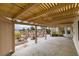 Covered patio with a view of lush landscaping, rock features and an ornate fountain at 5416 Lochmor Ave, Las Vegas, NV 89130