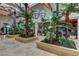 Elegant lobby with lush tropical plants and modern light fixtures at 56 Island Course Ave, Las Vegas, NV 89148