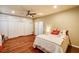 Inviting bedroom with wood floors, overhead lighting, and closet with doors at 5615 Criollo Dr, Las Vegas, NV 89122