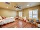 Well-lit bedroom with wood floors, and shuttered windows at 5615 Criollo Dr, Las Vegas, NV 89122