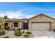 Charming single-story home with desert landscaping and a two-car garage at 5615 Criollo Dr, Las Vegas, NV 89122