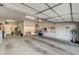 Spacious garage featuring an automatic door, overhead lighting and ample storage space at 5615 Criollo Dr, Las Vegas, NV 89122