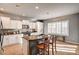 Bright kitchen with white cabinets, stainless steel appliances, and a granite island at 5615 Criollo Dr, Las Vegas, NV 89122