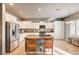 Bright kitchen features granite counters, an island with seating, and stainless steel appliances at 5615 Criollo Dr, Las Vegas, NV 89122