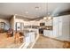 Open-concept kitchen with white cabinets, stainless steel appliances, and island with seating at 5615 Criollo Dr, Las Vegas, NV 89122