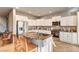Spacious kitchen with white cabinets, stainless steel appliances, and granite island at 5615 Criollo Dr, Las Vegas, NV 89122