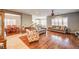 Spacious living room featuring hardwood floors, neutral walls, and lots of natural light at 5615 Criollo Dr, Las Vegas, NV 89122
