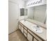 Double vanity bathroom with a large mirror at 6104 Daisy Lee Ave, Las Vegas, NV 89108