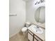 Clean bathroom with vanity, toilet and oval mirror at 6104 Daisy Lee Ave, Las Vegas, NV 89108