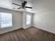 Upstairs bedroom with carpet, ceiling fan and window at 6104 Daisy Lee Ave, Las Vegas, NV 89108