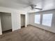 Well-lit bedroom, featuring carpet and ceiling fan at 6104 Daisy Lee Ave, Las Vegas, NV 89108