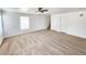 Living room with carpet, ceiling fan and stairs to upper level at 6104 Daisy Lee Ave, Las Vegas, NV 89108