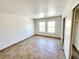 Well-lit bedroom with tile floors and double closets at 6149 Ethel May Ave, Las Vegas, NV 89108