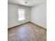 Bright bedroom with a large window and tile flooring at 6149 Ethel May Ave, Las Vegas, NV 89108