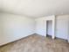 Simple bedroom with tile floors and mirrored closet doors at 6149 Ethel May Ave, Las Vegas, NV 89108