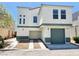 Two-story house with green accents and a two-car garage at 6149 Ethel May Ave, Las Vegas, NV 89108