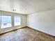 Bright and airy living room with tile floors and large windows at 6149 Ethel May Ave, Las Vegas, NV 89108