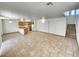 Open floor plan with kitchen, living room, and staircase at 6149 Ethel May Ave, Las Vegas, NV 89108