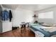 Small bedroom with twin beds, wood floors, and ample closet space at 625 S Royal Crest Cir # 23, Las Vegas, NV 89169