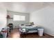 Small bedroom with twin beds, wood floors, and a window at 625 S Royal Crest Cir # 23, Las Vegas, NV 89169