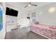 Bright bedroom with a cozy unicorn-themed bed, workspace, and playful decor at 7011 Toll Mountain St, North Las Vegas, NV 89086