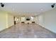 Large basement recreation room with tiled floors and a built-in entertainment center at 7045 Edna Ave, Las Vegas, NV 89117
