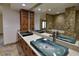 Bathroom with double sinks and large mirror at 7045 Edna Ave, Las Vegas, NV 89117