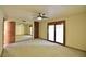 Large bedroom with mirrored closet doors and sliding glass doors at 7045 Edna Ave, Las Vegas, NV 89117