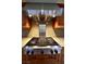 Stainless steel gas cooktop with grill and range hood at 7045 Edna Ave, Las Vegas, NV 89117