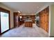 Spacious kitchen, stainless steel appliances, wood cabinetry, and tile floors at 7045 Edna Ave, Las Vegas, NV 89117
