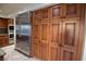 Kitchen features ample wood cabinetry and a large stainless steel refrigerator at 7045 Edna Ave, Las Vegas, NV 89117