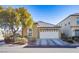 Single-story house with attached garage and landscaping at 7368 Savannah Falls St, Las Vegas, NV 89131