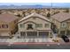 Two-story townhome with attached garage and mountain views at 7455 Snowy Owl St # 102, North Las Vegas, NV 89084