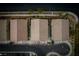 Three townhomes with tile roofs, seen from above at 7455 Snowy Owl St # 102, North Las Vegas, NV 89084