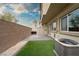 Artificial turf backyard with patio, and block wall at 7455 Snowy Owl St # 102, North Las Vegas, NV 89084